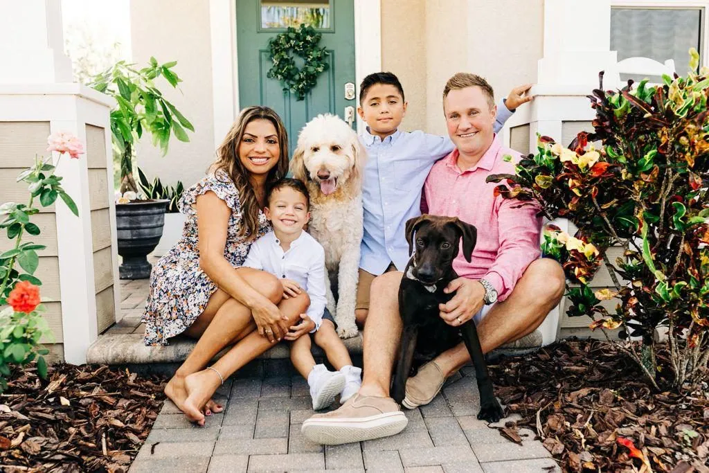 The whole family on the front steps, Charlie and Wilson included